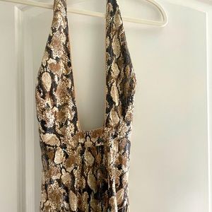 Brand new. Size small. Beautiful sequins, stretchy side slit dress. Snake pttern